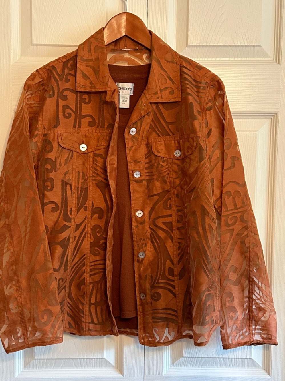 Chico's Rust Brown Sleeveless Crewneck Tank and transparent over jacket.
